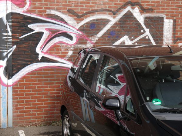 2016.04 - Amsterdam photo of graffiti art - 'Wall-tag meets car' - street art with reflections in Amsterdam city - geotagged free urban picture, in public domain / Commons; Dutch photography, Fons Hei...