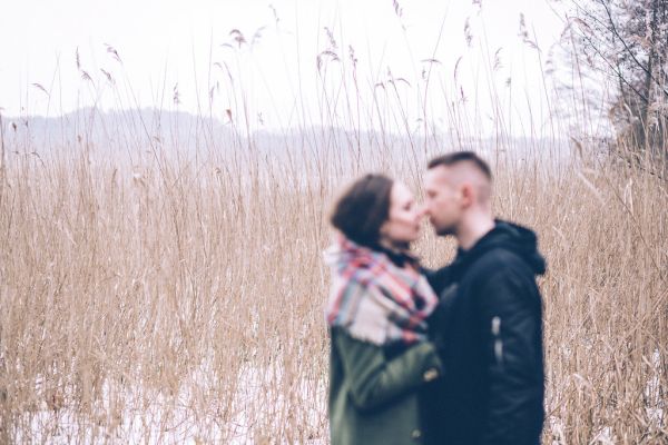 A blurred couple about to kiss