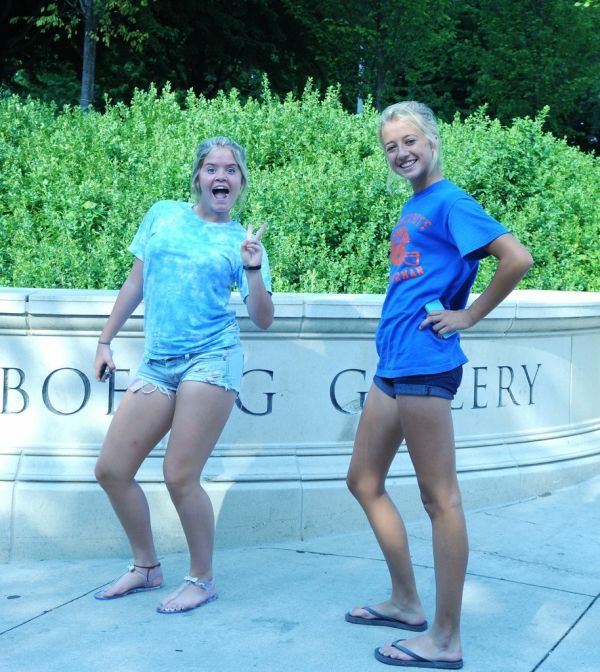 American girls, peace sign, shorts, sandels, legs, Boeing Gallery, downtown, Chicago, Illinois, USA