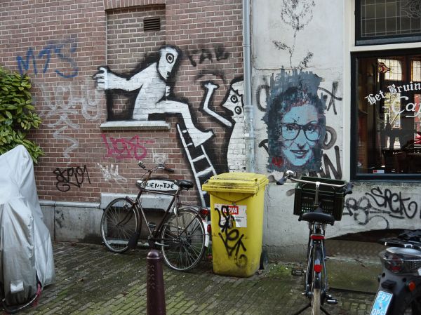 'Anne Frank portrait, in urban wall-painting on the corner Anjelierstraat and the canal Prinsengracht - Jordaan district Amsterdam, November 2013; photo Amsterdam city; Dutch photographer Fons Heijnsb...