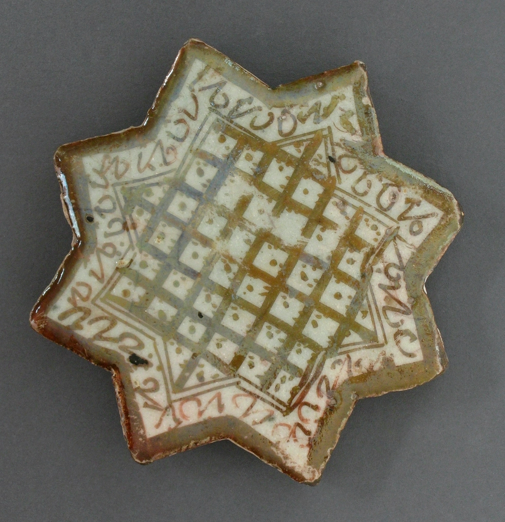 Antique star-shaped ceramic tile