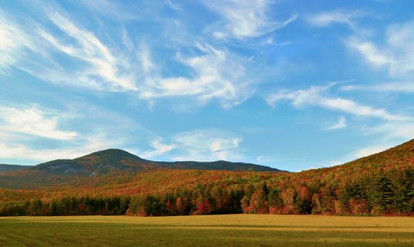 Autumn Foiliage under whispy clouds at Grafton Notch, Maine, USA