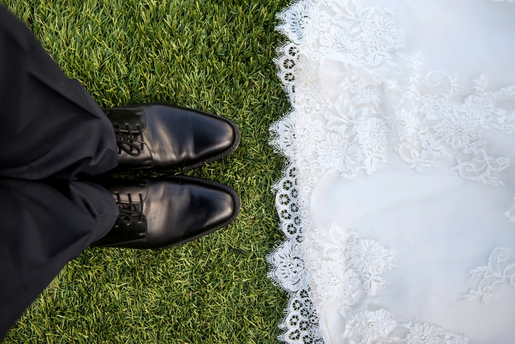 Bride wearing lace dress faces