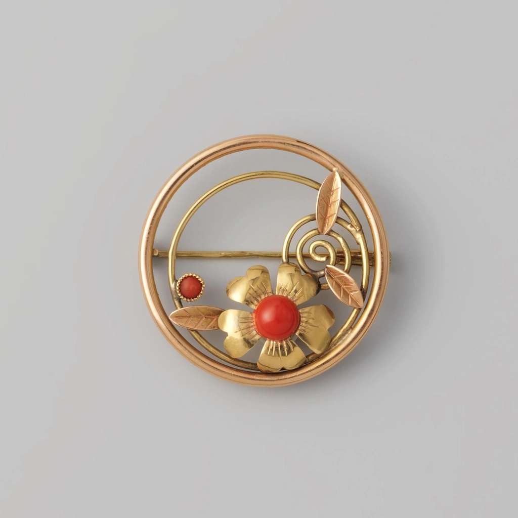 Broche van gouddraad met bloem