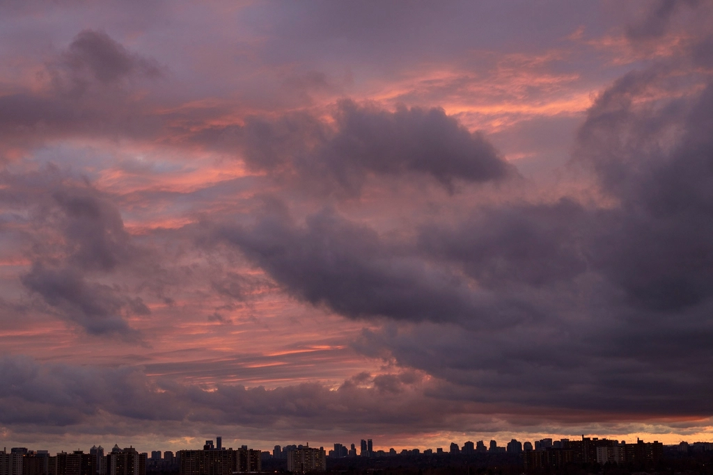 Cloudy sunset sky city skyline