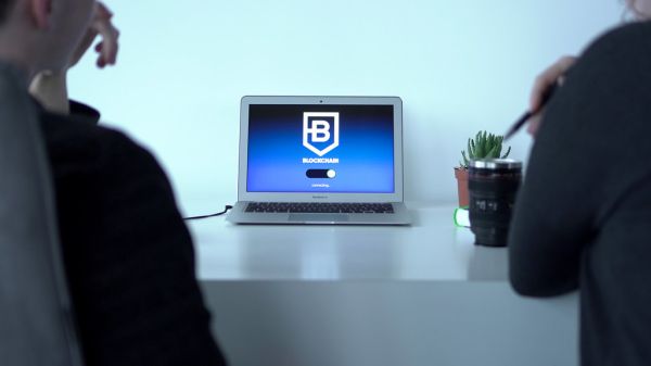 Colleagues connecting to a blockchain application