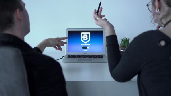 Colleagues talking about blockchain app