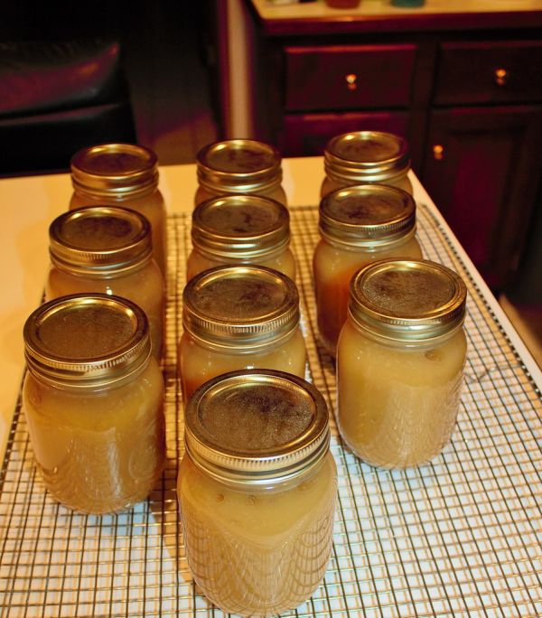 Cooling jars of applesauce on rack