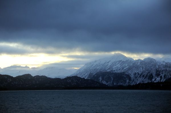 Deep blues and gray whites of the Kenai Pennisula Mountain Range, winter, over Katchemak Bay, off Homer Spit, Homer, Alaska, USA