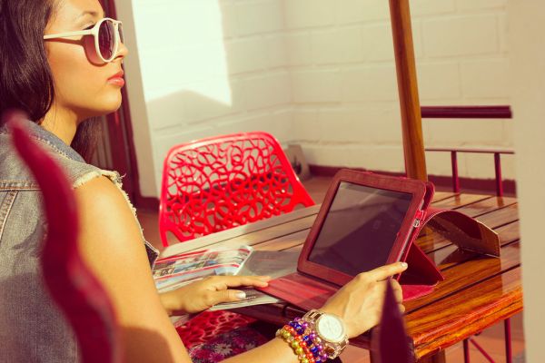 Female Using Tablet Computer in Sunlight