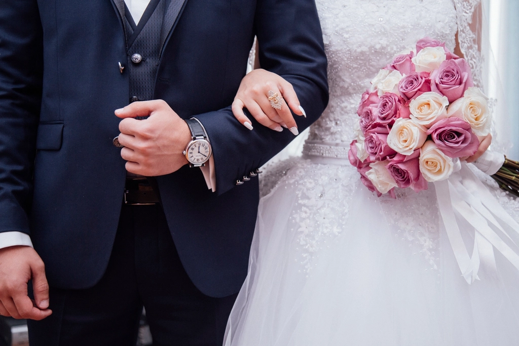 Free bride holding flower bouquet