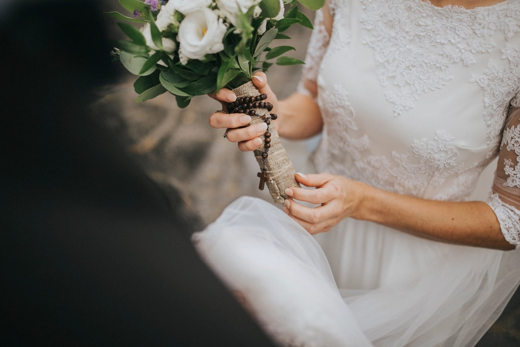 Free bride holding flower bouquet