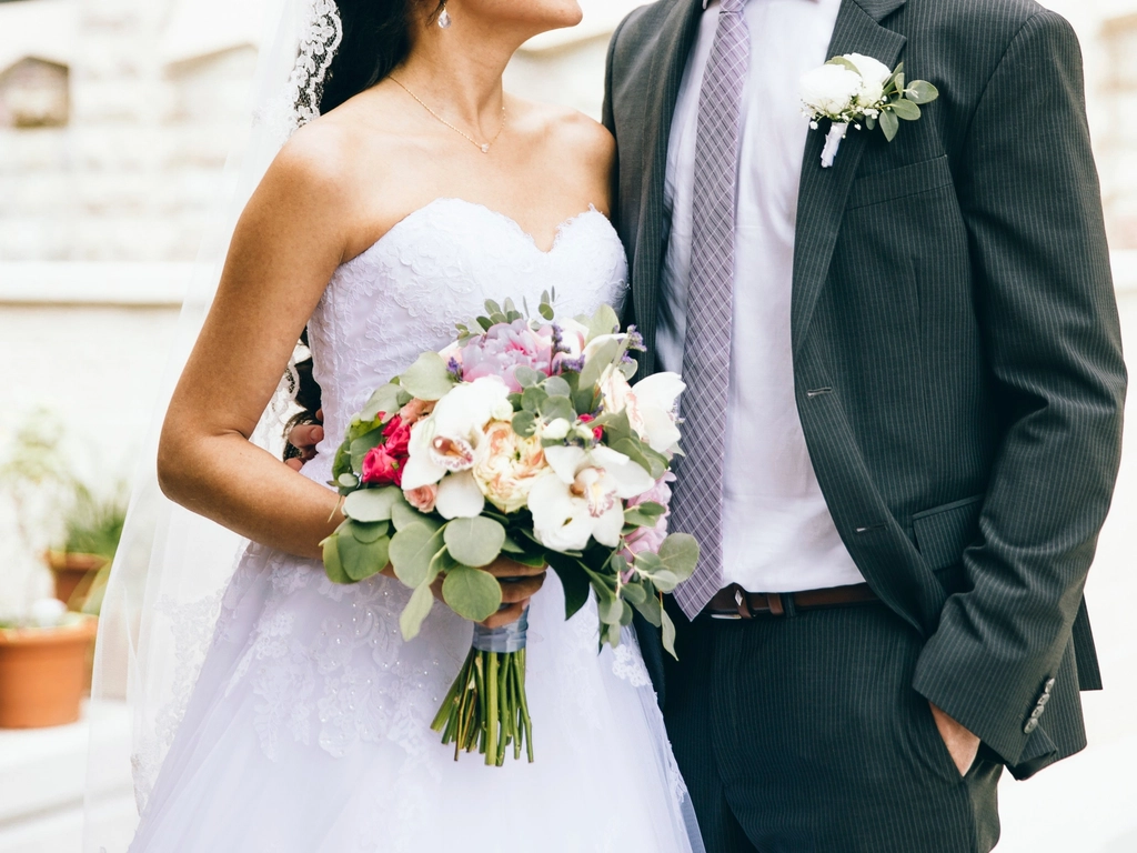 Free bride holding flower bouquet