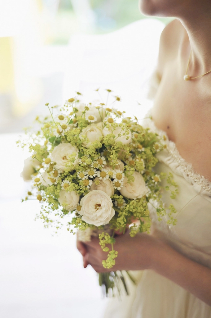 Free bride holding flower bouquet