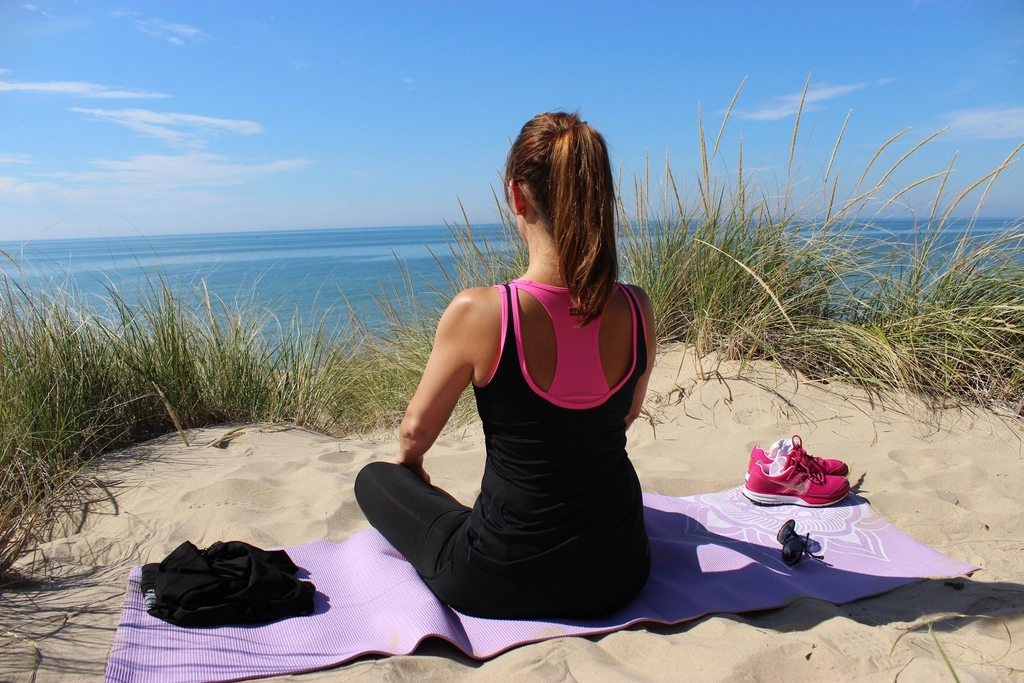 Free woman doing yoga pose