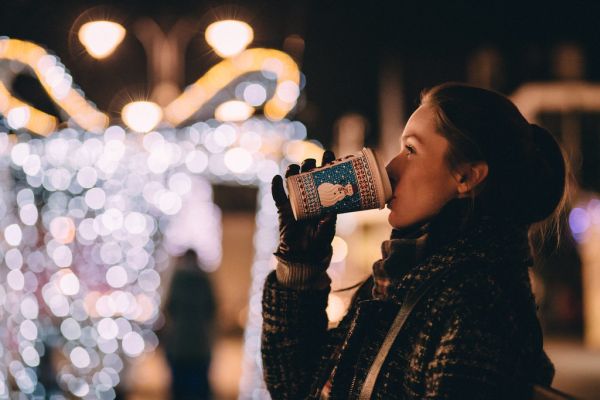 Girl drinking coffee in winter