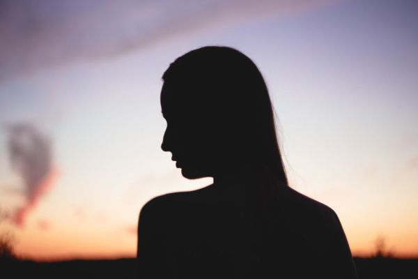 Girls head silhouette at sunset