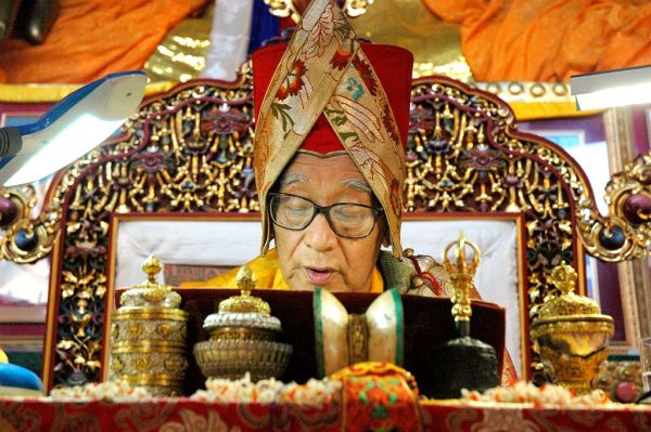 His Holiness Jigdal Dagchen Sakya Rinpoche on the throne wearing the Sashu (Sakya Hat) on the throne giving the transmission at Tharlam Monastery, Lam Dre, Boudha, Kathmandu, Nepal