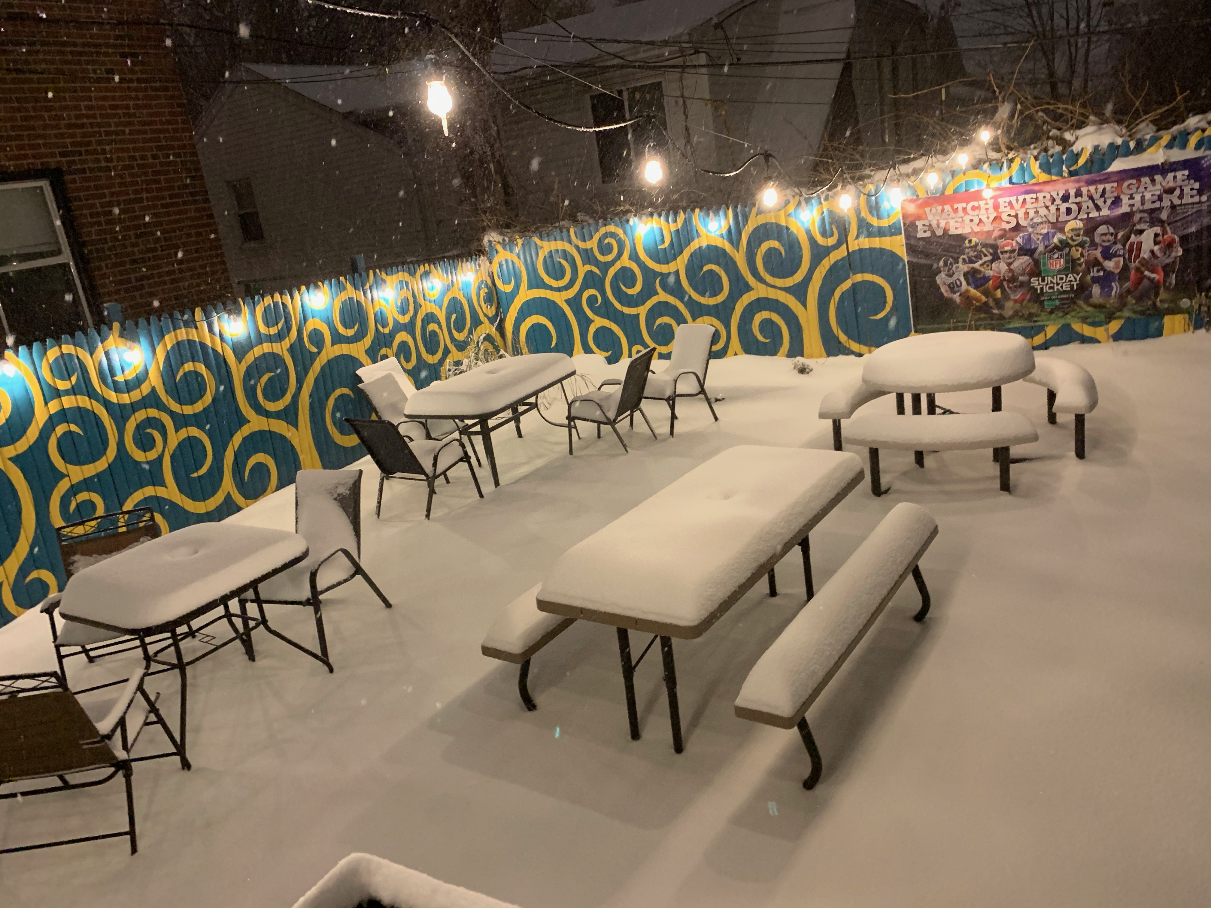 Local bar outdoor seating during winter snow
