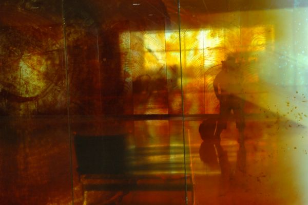 Luminous self portrait in holographic elevator bench camera tree rings hat and reflected shadow, Seattle, Washington, USA