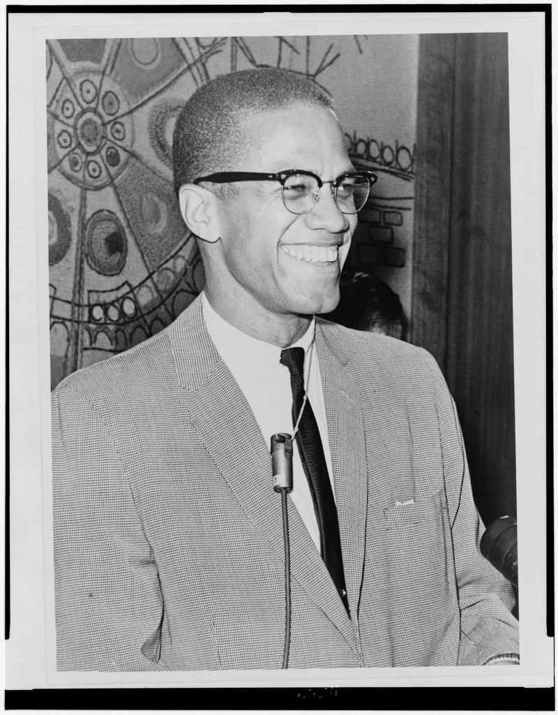 Malcolm X, half-length portrait, facing