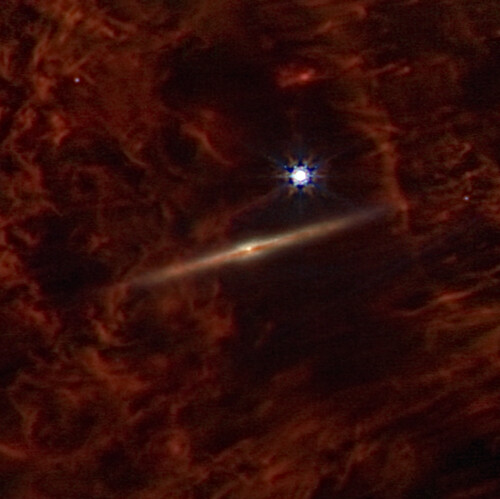 NASA has imaged a Galaxy nestled beyond a Nebula