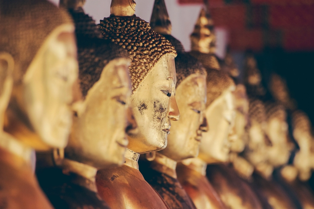 Row golden statues Buddha religious