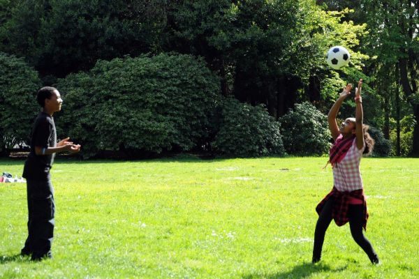 She returns. Playing 1 on 1 volleyball without a net, Eritrean children at play, Eritrea independence anniversary celebration, (land of Punt), Volunteer Park, Capitol Hill, Seattle, Washington, USA