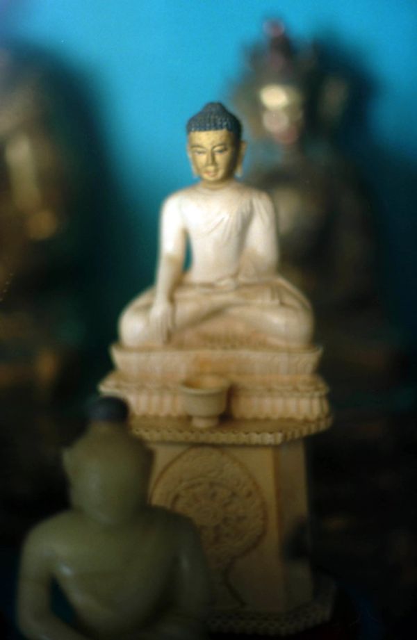 Small statue of Lord Buddha in the earth touching mudra, offering bowl, Wheel of the Dharma, Buddhist statues, Tibetan Works and Archives, library, Dharamasala, India