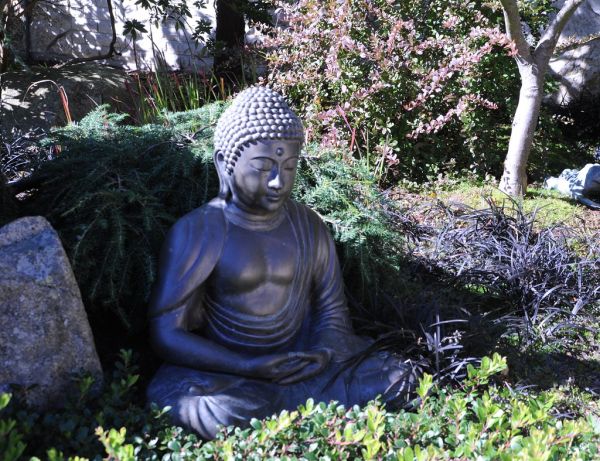 Statue of Buddha in meditation position, garden, View Ave NW, Seattle, Washington, USA