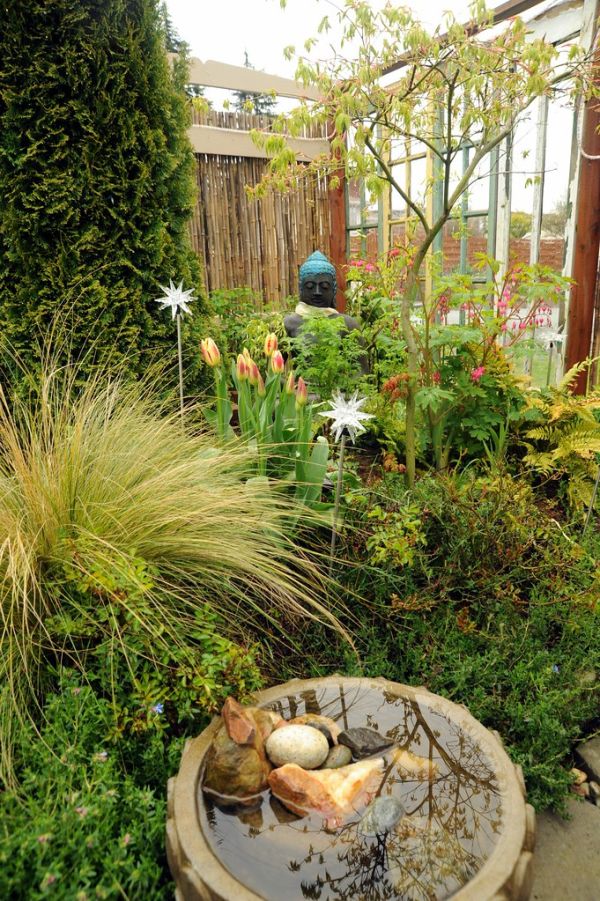 Stillness - Buddha statue, khatak (Tibetan Buddhist white ritual scarf), wrapped up in spring, fountain, star lights, blue star lithadora, windows, reflection, ferns, bleeding hearts, Japanese maple,...