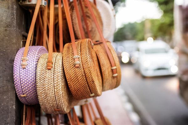 Stylish rattan handbags on the balinese street in Ubud.