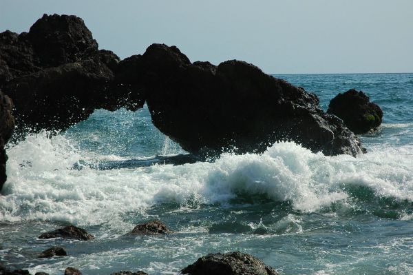 Water under the bridge, little rock arch, splash of the Pacific Ocean, South Mazatlan, Sinaloa, Mexico