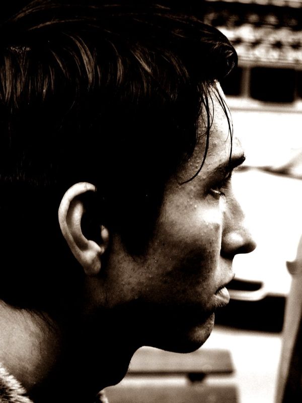 Young Man entering the Tram