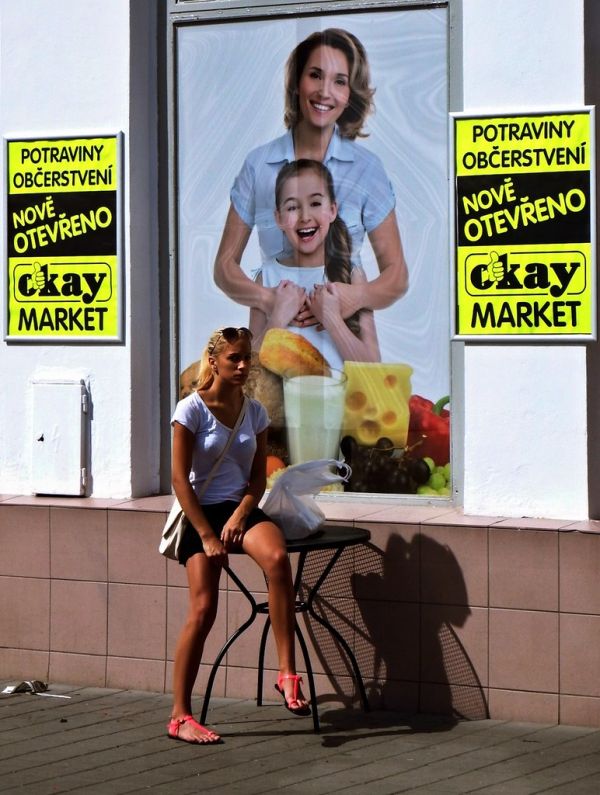 Young Woman in front of Newly Opened Shop