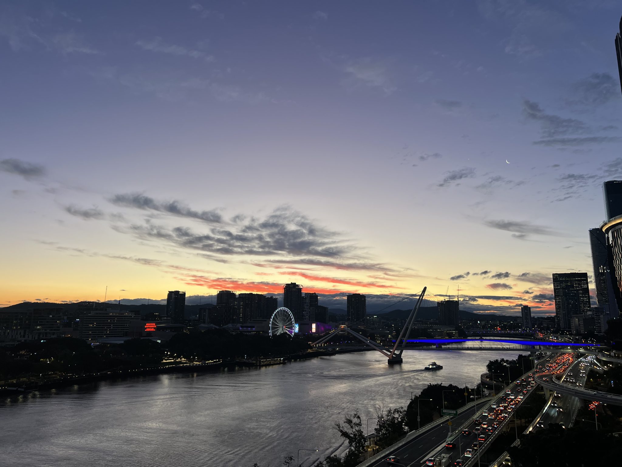 Brisbane city skyline on sunset as seen from QUT Gardens Point.