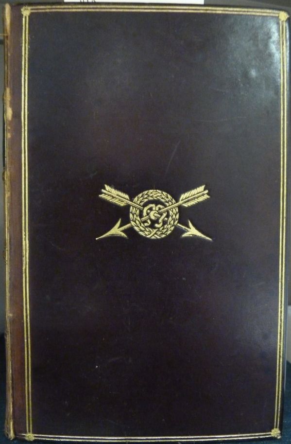 Crest of Harrow School, Harrow, England, on the top board of a book awarded to Harry Amyas Leigh Herschel Wade by Edward E. Bowen in 1888