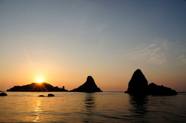 Islands of the Cyclops at Dawn Sicily Italy - Creative Commons by gnuckx