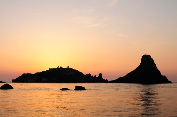 Islands of the Cyclops at Dawn Sicily Italy - Creative Commons by gnuckx